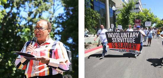 Asm. Wilson holding microphone, speaking; parade participants holding up banner