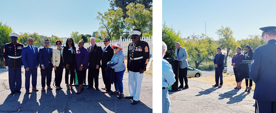 Group photo of Asm. Wilson and attendees; Asm. Wison listens on while guest speaker speaks